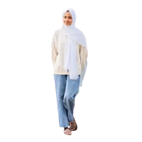 Woman in a white hijab and casual attire posing for an about me page
